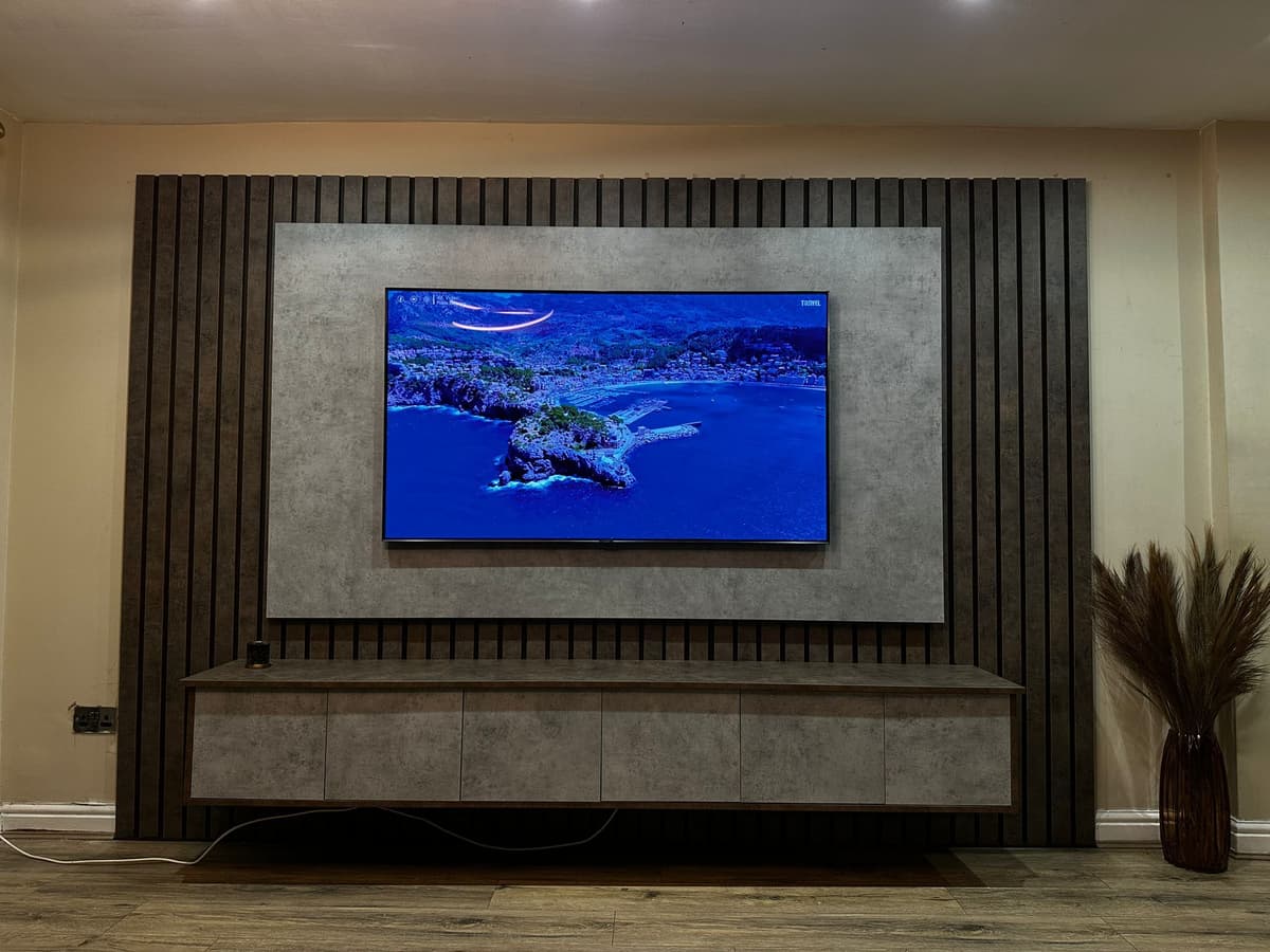 Custom fitted media wall unit with integrated TV and ambient lighting