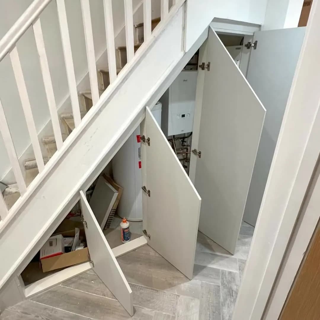Bespoke under stairs storage with pull-out drawers and shoe organizers