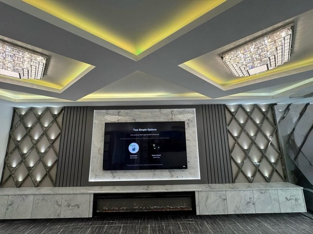 Diamond Panel Wall with Marble Fireplace and Tall Cupboards 1