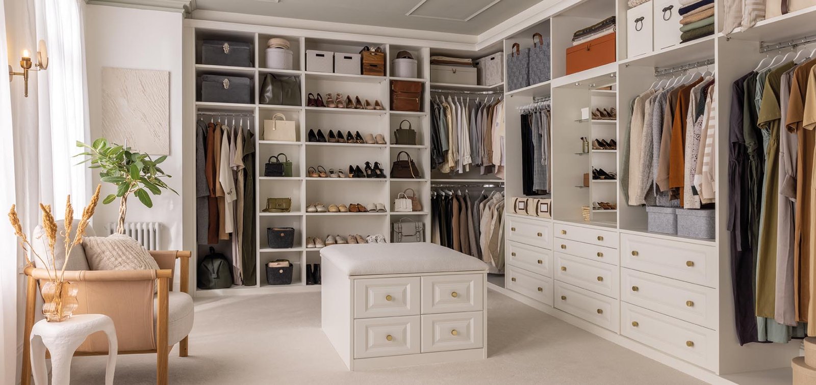 Modern loft conversion walk-in wardrobe with custom shelving and drawers