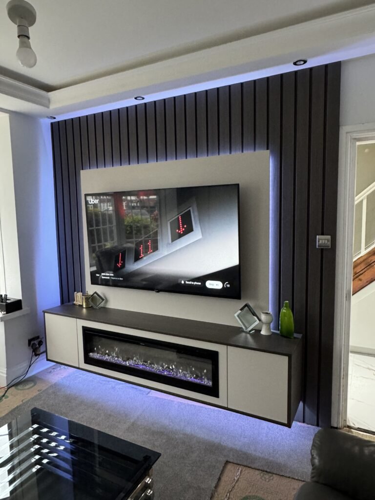 TV Displaying Mountain Landscape Scene in a Modern Media Wall Setup angle 2