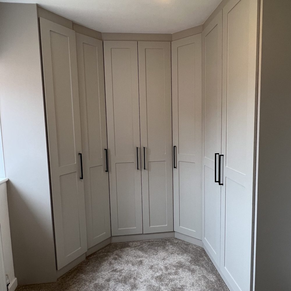 Spacious walk-in fitted wardrobe furniture with shelving and LED lighting